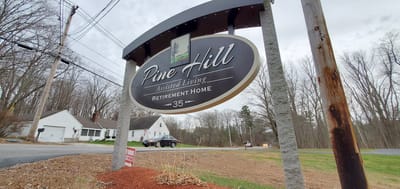 Facility logo on a roadside sign