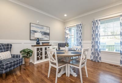 Bright common area with dining table and seating