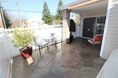 Outdoor patio area with seating and plants