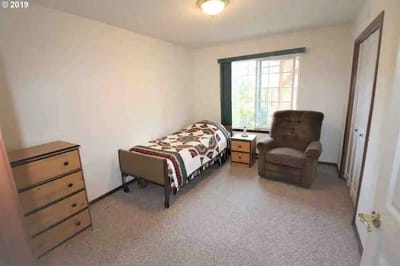 A private resident room with furniture and decor