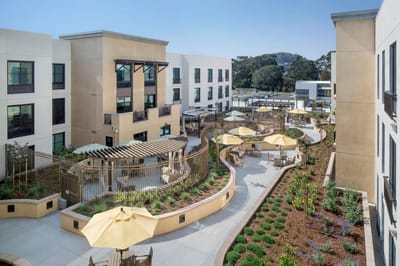 Aerial view of a landscaped outdoor space with seating
