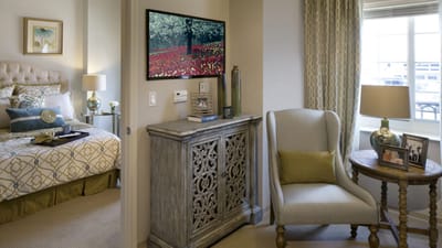 Cozy resident room with bed and seating area