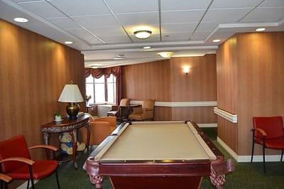 Common area with a pool table and seating