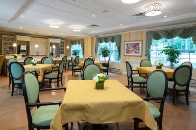 Bright and inviting dining room with tables and plants