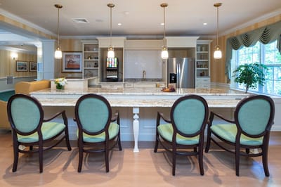 Bright common area with kitchen and seating