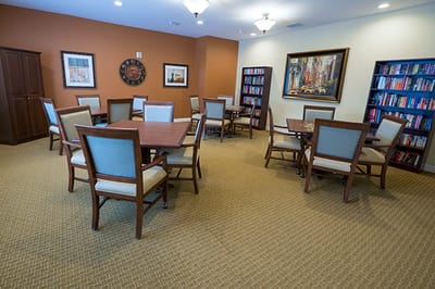 Common area with tables and bookshelves