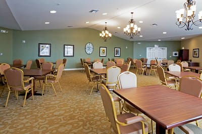 Interior view of a dining hall with tables and chairs