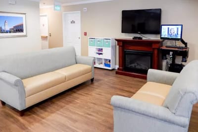 Interior view of a common area with sofas and a fireplace