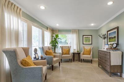 Bright sitting area with comfortable chairs and decor