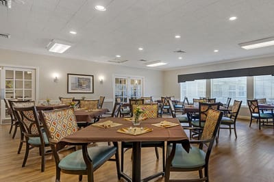 Dining area with tables and colorful chairs