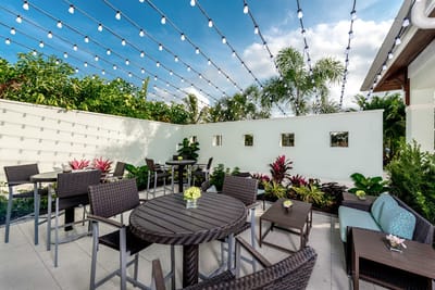 Outdoor patio area with seating and decorative lighting