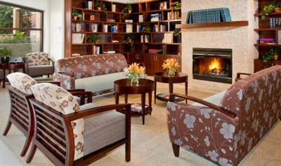 Cozy common area with seating and a fireplace