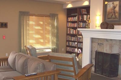Cozy common area with seating and bookshelves