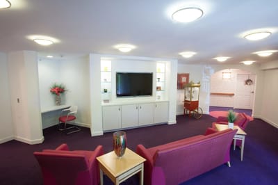 Interior common area with seating and a television