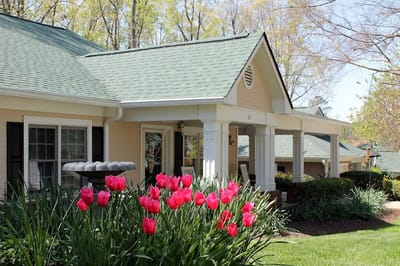 Building exterior with colorful flowers in the foreground