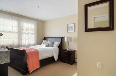 Well-furnished bedroom in a senior living facility