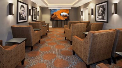 A cozy common area with comfortable seating and artwork