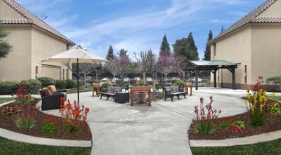 Outdoor garden area with seating and flowers