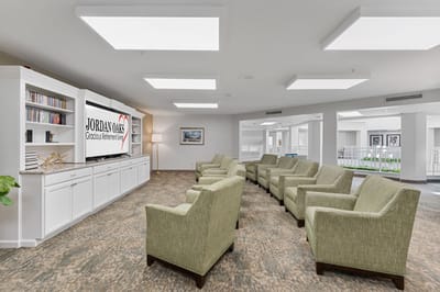 Bright interior common area with seating and a television