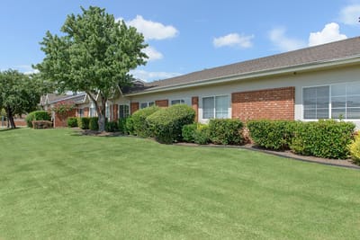 Well-maintained outdoor area with grass and landscaping