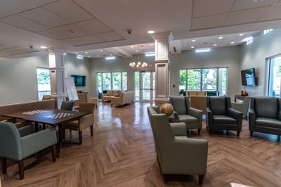 A bright common area with seating and natural light