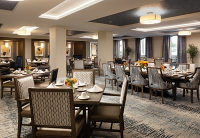Elegant dining room with set tables and floral arrangements