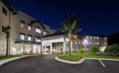 Exterior view of Paradise Pointe Assisted Living at night