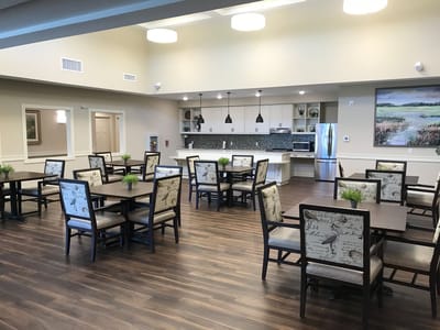 Bright dining area with tables and chairs