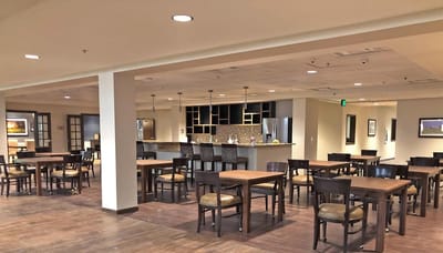 Dining area with tables and chairs in a communal space