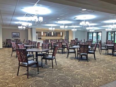 Bright dining room with tables and chairs