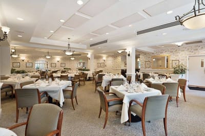 Elegant dining room setup with tables and chairs