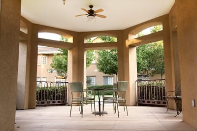 Outdoor seating area with tables and chairs