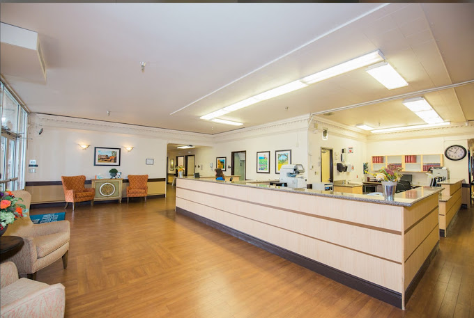 Interior shot of a facility lobby area with reception desk