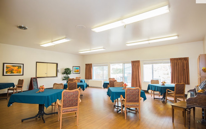 Bright common area with tables and chairs