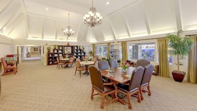 Bright common area with dining tables and chairs