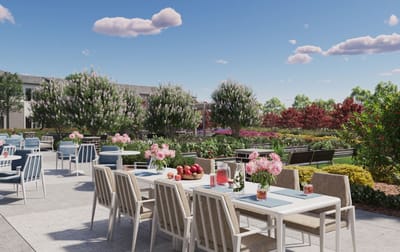 Outdoor dining area with tables and flowers