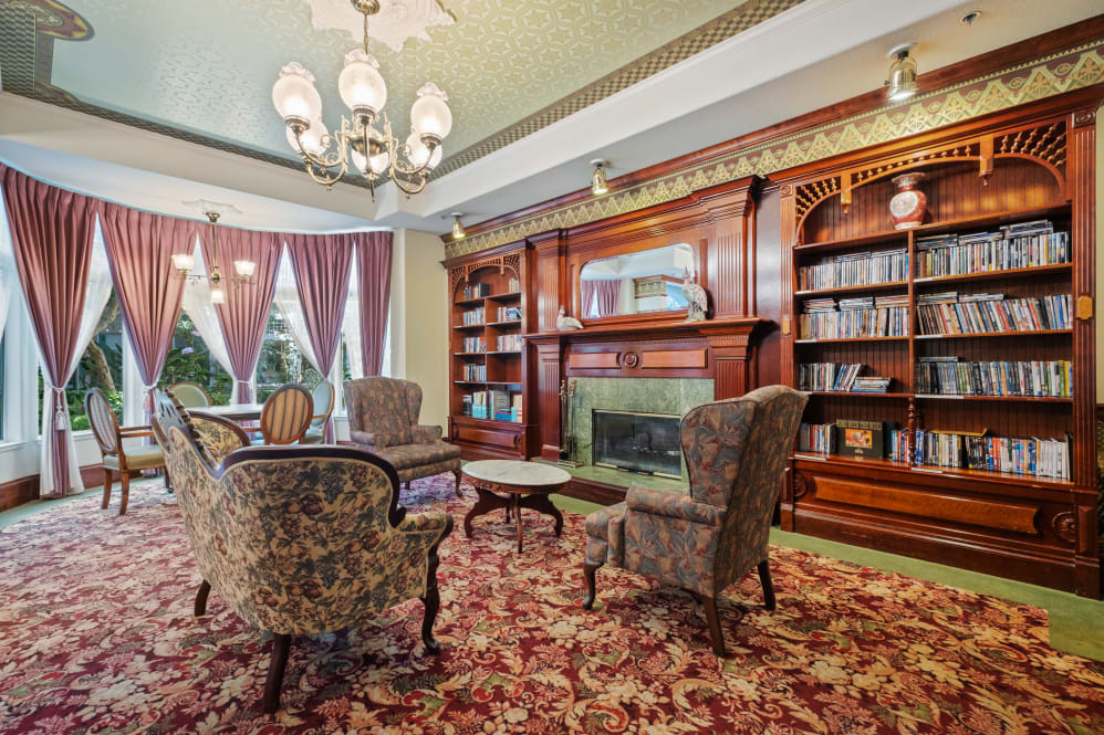 Common area with a cozy seating arrangement and bookshelves