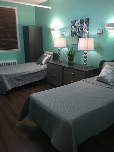 Cozy resident room with two beds and modern decor