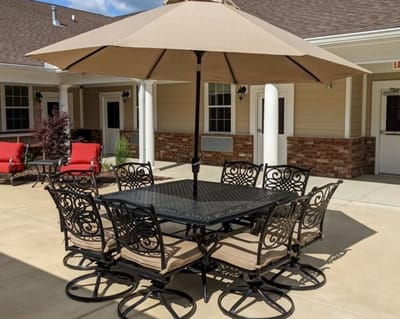 Outdoor dining area with seating and umbrella