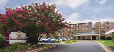 Exterior view of The Hidenwood with flowering trees