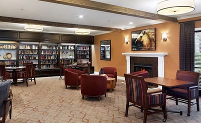 Interior common area with seating and bookshelves