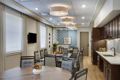 Common area with tables and decor in a bright room