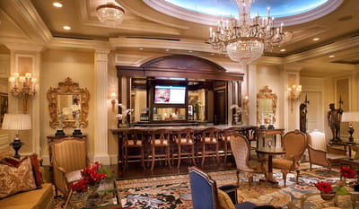 Elegant lobby area with chandeliers and decor