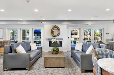 Bright common area with comfortable seating and decor