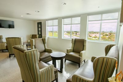 Common area with comfortable seating and windows