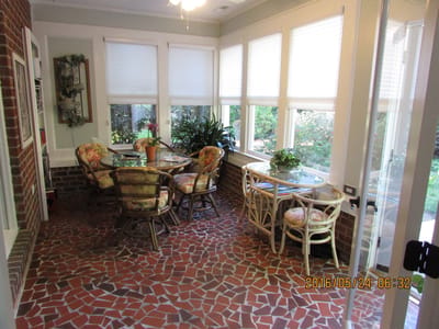 Bright sunroom with seating and plants