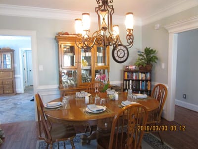 A cozy dining room set for a meal