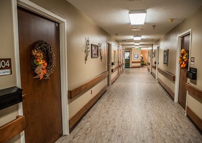 Hallway with decorated doors and autumn wreaths