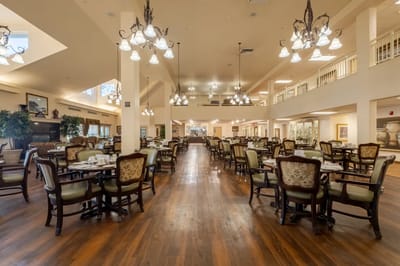 Dining room with tables and chairs in a common area