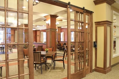 Interior view of a dining room with tables and chairs